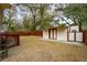Backyard with a storage shed, fencing, and mature trees at 1162 South Shadow Dr, Mount Pleasant, SC 29464