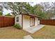 Backyard features a storage shed, fencing, and mature trees at 1162 South Shadow Dr, Mount Pleasant, SC 29464