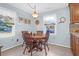 Cozy dining area with wooden table and chairs, soft blue walls, and natural light at 1162 South Shadow Dr, Mount Pleasant, SC 29464