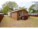 Exterior view of a brick home with a backyard and fencing at 1162 South Shadow Dr, Mount Pleasant, SC 29464