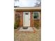 Charming front entrance with a brick facade and decorative plants at 1162 South Shadow Dr, Mount Pleasant, SC 29464