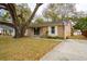 Inviting one-story home with brick facade, a sprawling tree, and well-kept lawn at 1162 South Shadow Dr, Mount Pleasant, SC 29464
