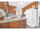 Well-lit kitchen with tile countertops, ample cabinetry, and white refrigerator at 1162 South Shadow Dr, Mount Pleasant, SC 29464