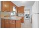 Functional kitchen featuring ample cabinet space, tiled countertops, and access to the sunroom at 1162 South Shadow Dr, Mount Pleasant, SC 29464