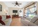 Comfortable living room with a ceiling fan, entertainment center, and abundant natural light at 1162 South Shadow Dr, Mount Pleasant, SC 29464