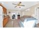 Bright living space with a ceiling fan, hardwood floors, a comfortable seating area, and wooden kitchen cabinetry at 1162 South Shadow Dr, Mount Pleasant, SC 29464