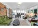 Bright sunroom featuring brick accents, tiled floor, and lots of windows, perfect for relaxing or entertaining at 1162 South Shadow Dr, Mount Pleasant, SC 29464