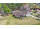 Expansive property featuring a brick home, detached garage, a backyard pool, and mature trees at 117 Hartin Blvd, Summerville, SC 29486