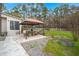 Outdoor patio with a dining table, gazebo, and grill, perfect for entertaining and enjoying the pool view at 117 Hartin Blvd, Summerville, SC 29486