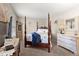 Serene bedroom with four-poster bed, neutral color scheme, and classic furnishings at 117 Hartin Blvd, Summerville, SC 29486