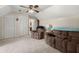 Cozy bedroom featuring a ceiling fan, two plush chairs, and ample closet space at 117 Hartin Blvd, Summerville, SC 29486