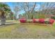 Beautifully landscaped front yard with colorful azaleas and a well-maintained lawn at 117 Hartin Blvd, Summerville, SC 29486