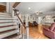 Inviting living room featuring hardwood floors, stairs, a ceiling fan, and decorative accents, offering a cozy atmosphere at 117 Hartin Blvd, Summerville, SC 29486