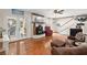 Cozy living room with hardwood floors, a brick fireplace, and French doors leading to another room at 117 Hartin Blvd, Summerville, SC 29486