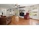 Comfortable living room featuring a brick fireplace, hardwood floors, and bright, natural light at 117 Hartin Blvd, Summerville, SC 29486