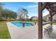 Beautiful pool area featuring a built-in bar, water features, and a spacious patio for lounging and entertaining at 117 Hartin Blvd, Summerville, SC 29486