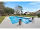 Sparkling pool with water features and a surrounding patio, perfect for outdoor relaxation and recreation at 117 Hartin Blvd, Summerville, SC 29486