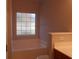 Bathroom featuring a frosted glass window, bathtub, and vanity at 1204 Grove Park Dr, Charleston, SC 29414
