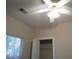 Bedroom featuring a ceiling fan, a window with blinds, and closet space at 1204 Grove Park Dr, Charleston, SC 29414