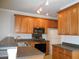 Kitchen with wood cabinets, stainless steel appliances, and stone countertops at 1204 Grove Park Dr, Charleston, SC 29414