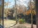 Scenic view of a tranquil pond with a fountain, surrounded by mature trees and lush foliage at 1204 Grove Park Dr, Charleston, SC 29414
