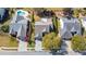 An aerial view captures neighborhood homes with mature landscaping and private pools at 123 Thousand Oaks Ct, Summerville, SC 29485