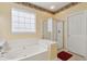 Bathroom featuring a soaking tub, a separate glass door shower and natural light at 123 Thousand Oaks Ct, Summerville, SC 29485