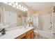 Bathroom with a long vanity with a white sink, shower over bath, and a decorative mirror at 123 Thousand Oaks Ct, Summerville, SC 29485