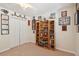 This carpeted bedroom includes a ceiling fan, closet, and a bookshelf for decorative items at 123 Thousand Oaks Ct, Summerville, SC 29485