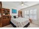 Bedroom with a ceiling fan, plantation shutters, and a bed with marine-themed patterns at 123 Thousand Oaks Ct, Summerville, SC 29485