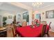 Elegant dining room featuring hardwood floors, chandelier, and seating for six guests at 123 Thousand Oaks Ct, Summerville, SC 29485