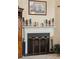 Close-up of a fireplace with decorative mantel, brass screen and nautical themed accents at 123 Thousand Oaks Ct, Summerville, SC 29485