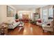 Open-concept living room with dining area, hardwood flooring, and natural light ideal for hosting gatherings or relaxing at 123 Thousand Oaks Ct, Summerville, SC 29485
