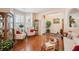 Tastefully decorated living room with hardwood floors and ample natural light perfect for receiving visitors and relaxing at 123 Thousand Oaks Ct, Summerville, SC 29485