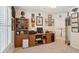 This carpeted home office features wood cabinets, decor, and a window that allows for plenty of sunlight at 123 Thousand Oaks Ct, Summerville, SC 29485