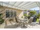 This patio features a white pergola, seating, and a grill at 123 Thousand Oaks Ct, Summerville, SC 29485