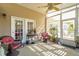Cozy sunroom with wicker chairs, a ceiling fan, and windows offering plenty of natural light at 123 Thousand Oaks Ct, Summerville, SC 29485