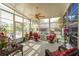 Bright sunroom with lots of windows that provide great views of the property's exterior and natural light at 123 Thousand Oaks Ct, Summerville, SC 29485
