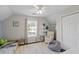 bedroom with hardwood floors, a window, a chair, and built-in shelving for books and toys at 1249 Shadow Mist Ln, Charleston, SC 29492