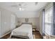 Bedroom with sloped ceiling, hardwood floors, a large window, and neutral decor and furnishings at 1249 Shadow Mist Ln, Charleston, SC 29492