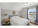 Minimalist bedroom with sloped ceiling, hardwood floors, and a large window with modern blinds at 1249 Shadow Mist Ln, Charleston, SC 29492