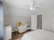 Bedroom featuring a white crib, chair, and dresser, hardwood floors, and neutral-toned decor at 1249 Shadow Mist Ln, Charleston, SC 29492