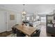 Bright open kitchen flows into the living room and dining area with modern finishes and stainless steel appliances at 1249 Shadow Mist Ln, Charleston, SC 29492