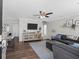 Cozy living room with dark sofa, area rug, and open floor plan at 1249 Shadow Mist Ln, Charleston, SC 29492