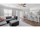Open living room with dark sectional, area rug, and bar seating at counter at 1249 Shadow Mist Ln, Charleston, SC 29492