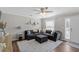 Living room featuring a sectional sofa, throw pillows, area rug, and natural light at 1249 Shadow Mist Ln, Charleston, SC 29492