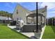 Outdoor patio with a furnished seating area, grill, string lights, and a well-manicured lawn at 1249 Shadow Mist Ln, Charleston, SC 29492