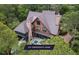 A captivating aerial view of a house with a metal roof, surrounded by lush greenery and a private pool at 127 Blue Heron Pond Rd # A, Kiawah Island, SC 29455