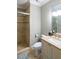 Comfortable bathroom featuring tiled shower, vanity with sink, and toilet at 127 Blue Heron Pond Rd # A, Kiawah Island, SC 29455