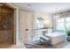 Elegant bathroom featuring a standalone tub, vanity area, and luxurious tiled shower at 127 Blue Heron Pond Rd # A, Kiawah Island, SC 29455